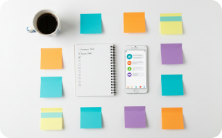 Colorful sticky notes and phone on a desk